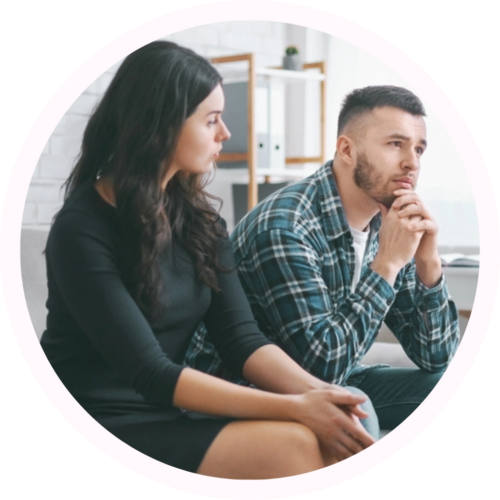 couple in a counselling session looking distressed and worried